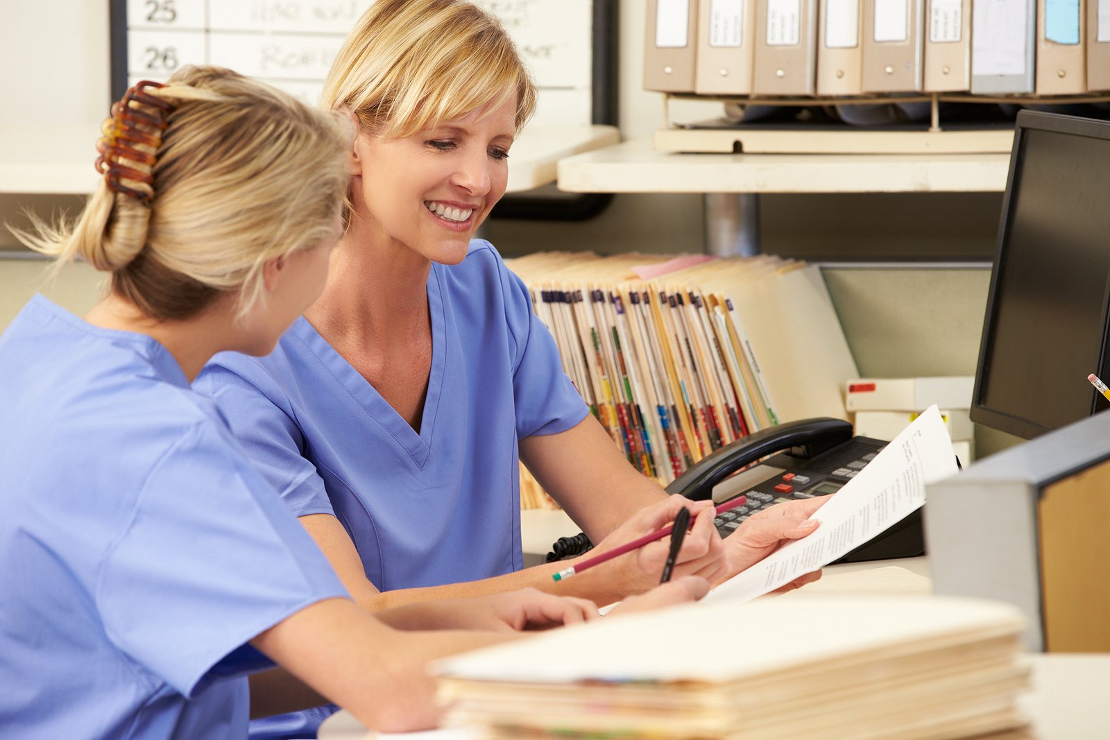 bigstock-Two-Nurses-Working-At-Nurses-S-41238661 bigstock-Two-Nurses-Working-At-Nurses-S-41238661